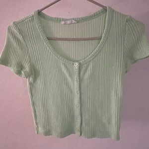 Green top, brand Elodie